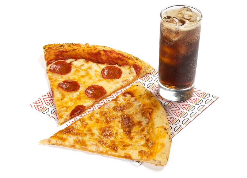 Two New York pizza slices with a soft drink